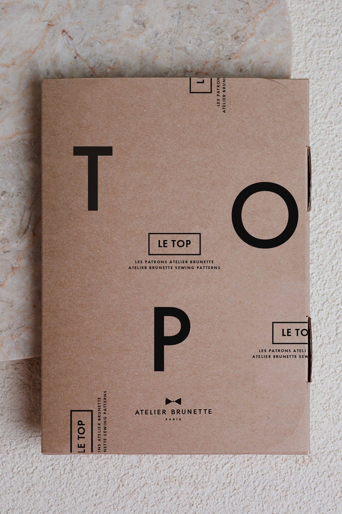 Atelier Brunette The Top printed sewing pattern envelope in kraft with large letters
