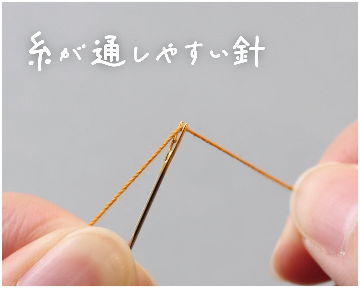 Cohana magic needles, close-up of the slotted eye being threaded