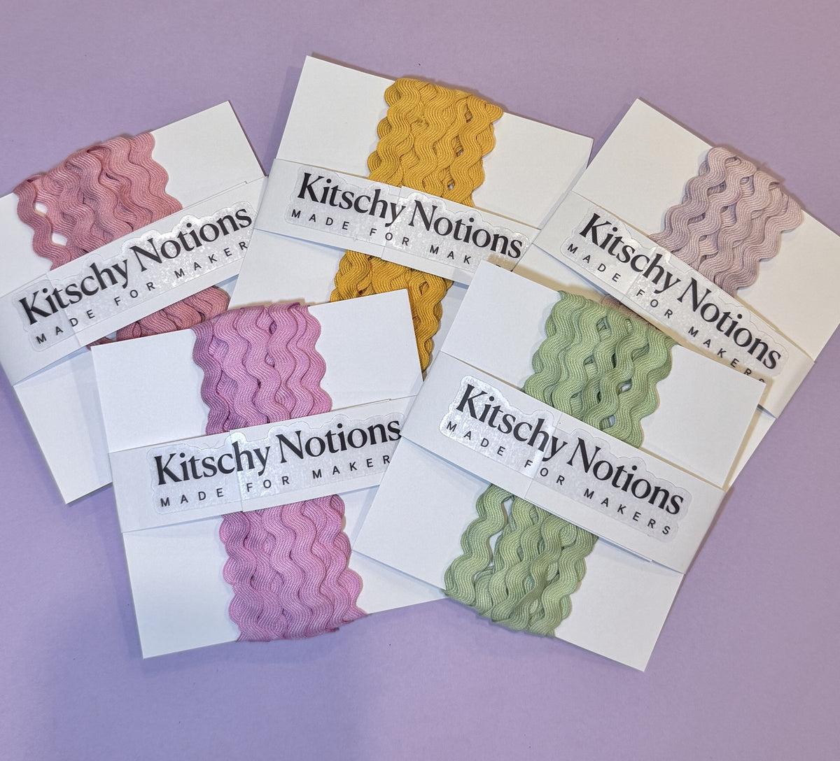 Hand-dyed Tencel ric-rac cards fanned out, including Moulin Rouge, Marigold, Stargazer, Pink Pony, and Seaglass