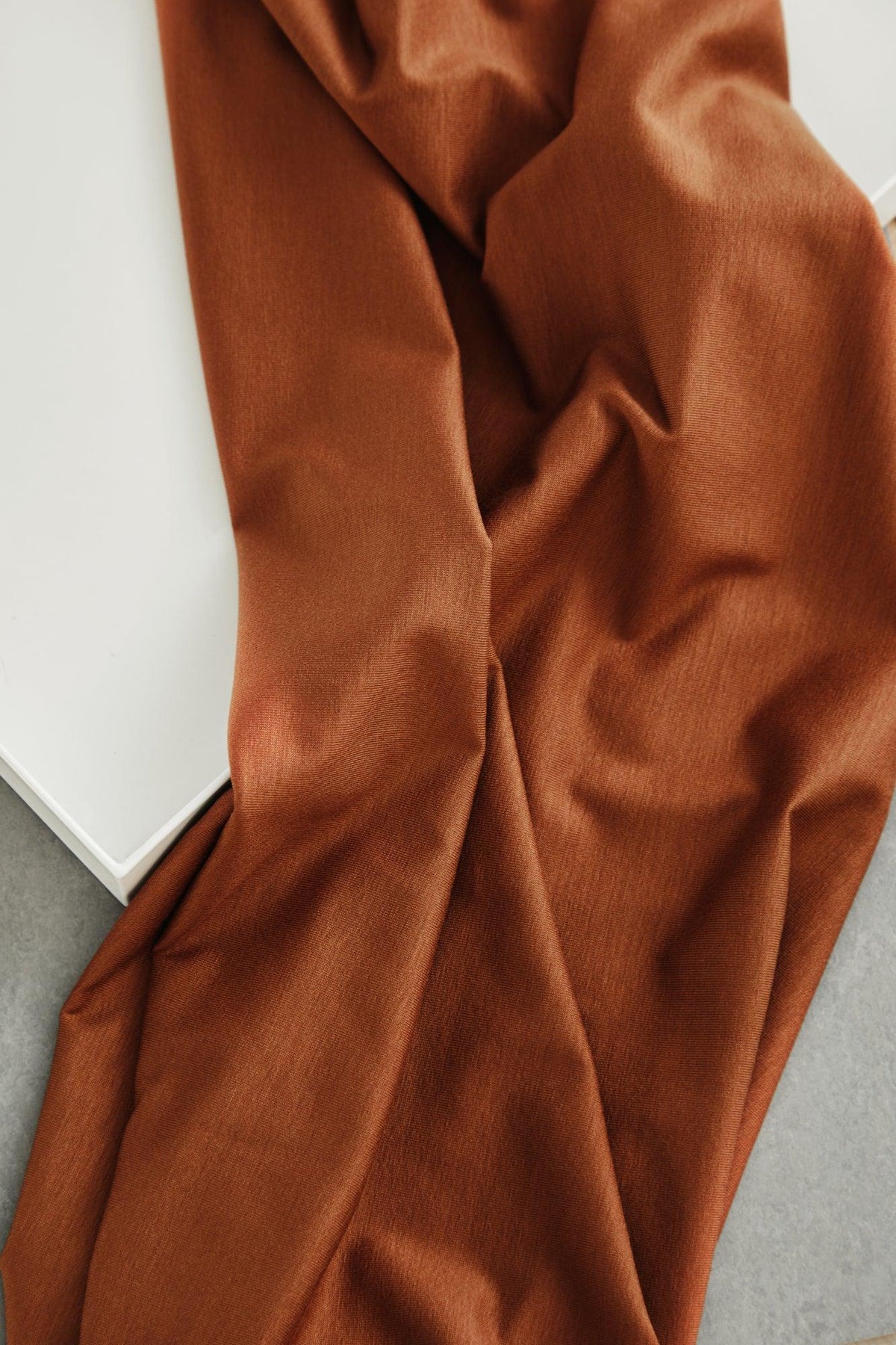 24/7 Stretch Lyocell Jersey in Pecan brown, soft knit fabric by the half yard draped to show stretch