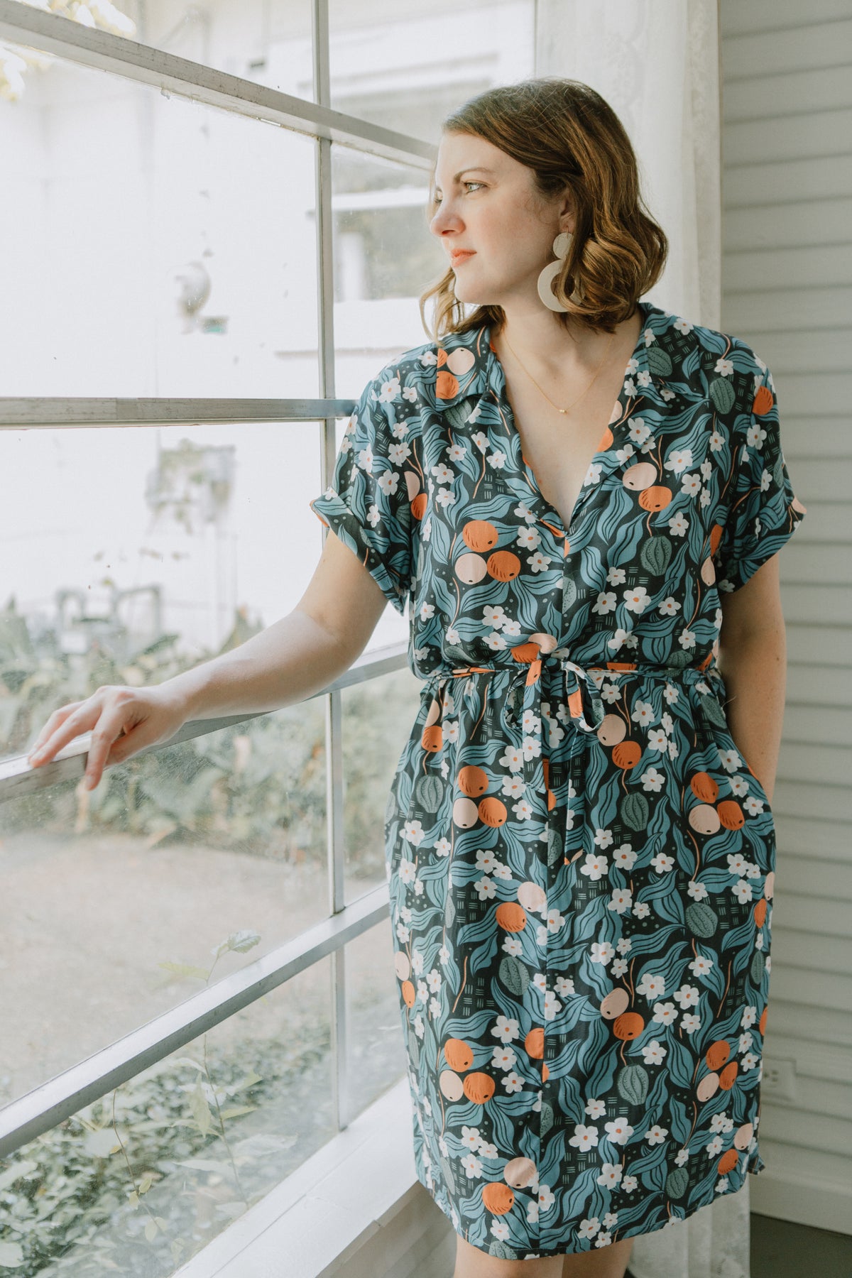 Sew to Grow Sydni Shirtdress PDF sewing pattern, green floral shirtdress outdoors