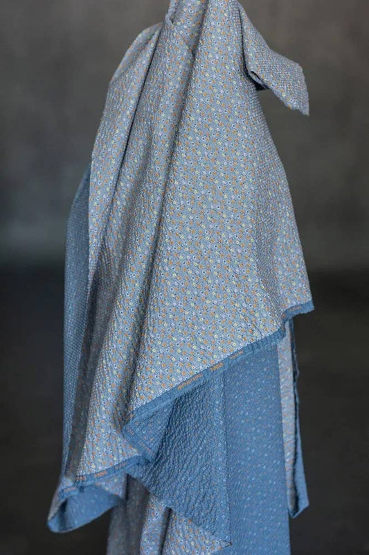 Merchant & Mills Suki Hana Japanese seersucker fabric, in blue and white, draped