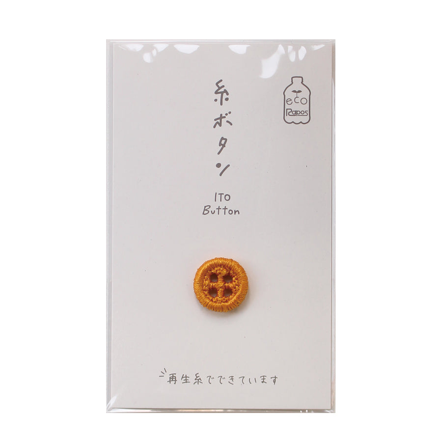 Cohana ITO 12mm sewing button, in green on its card