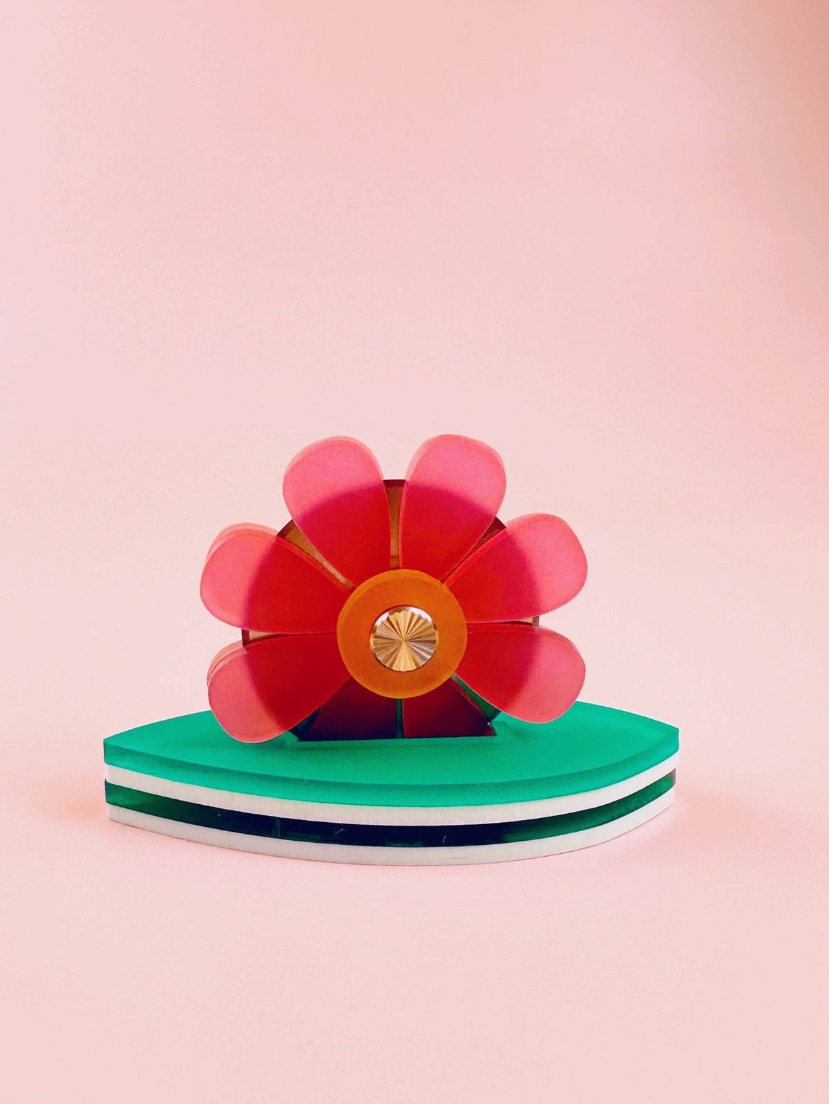 Feral Notions flower thread cutter in pink with a green leaf base, a sewing thread snip notion