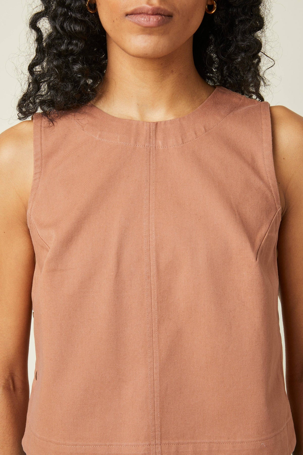 Close-up of a terracotta sleeveless top made with the Atelier Brunette The Top printed sewing pattern