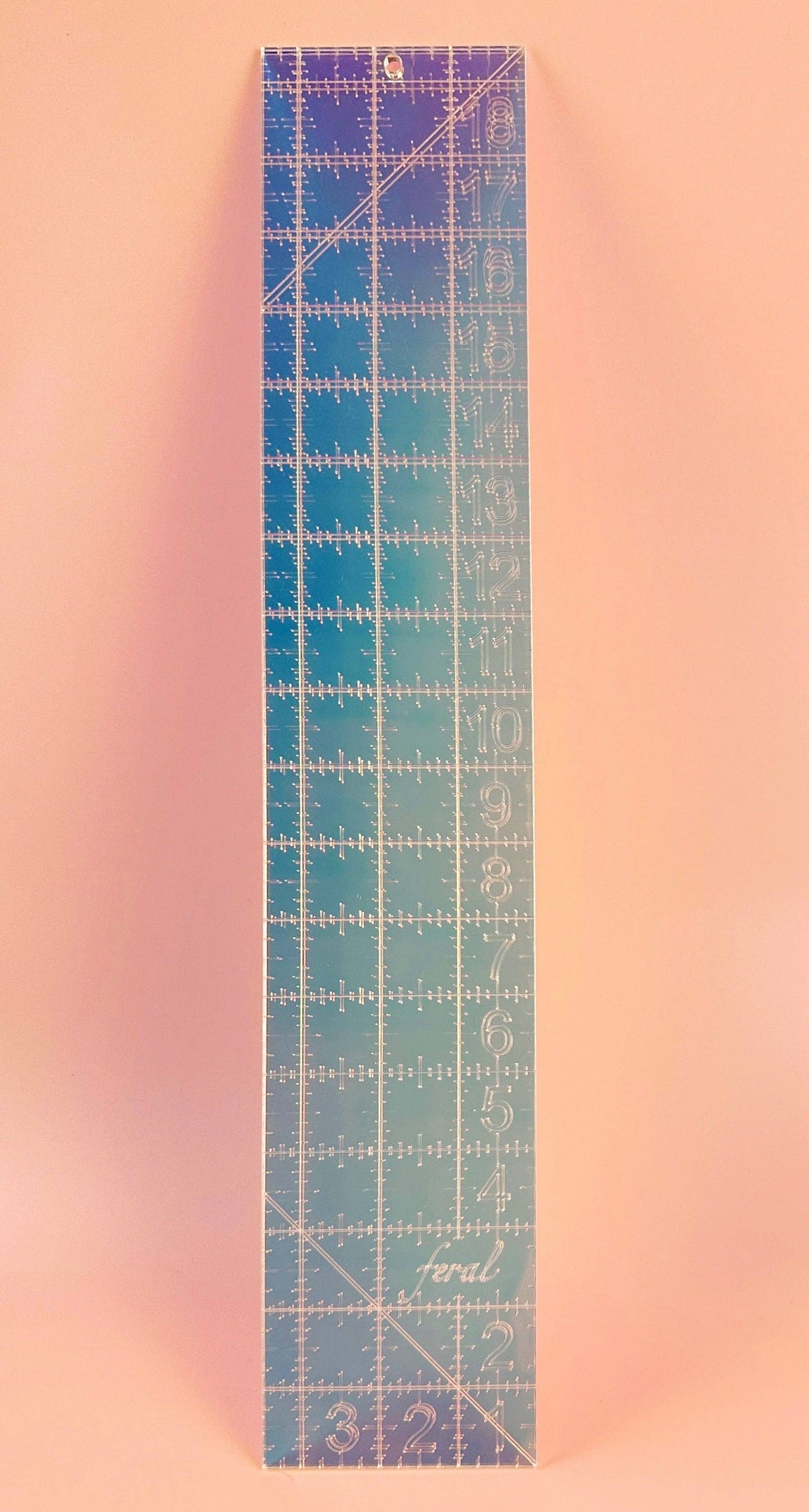 Feral Notions fat quarter quilting ruler in iridescent acrylic, straight-on view of the inch grid