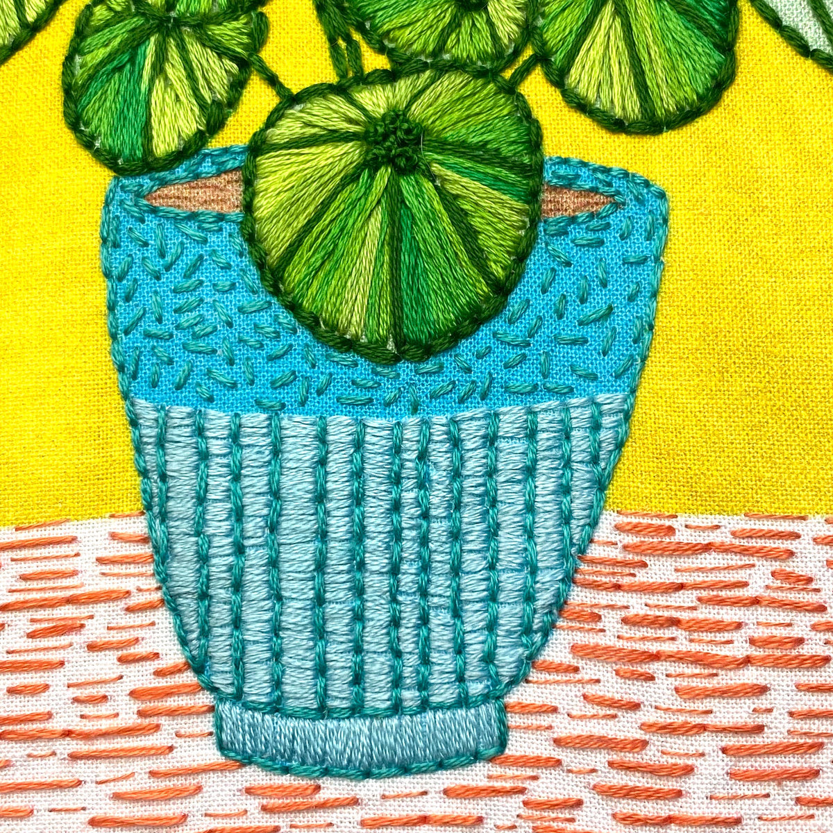 Keller Design Co. Pilea plant embroidery kit, close-up of the stitched pot