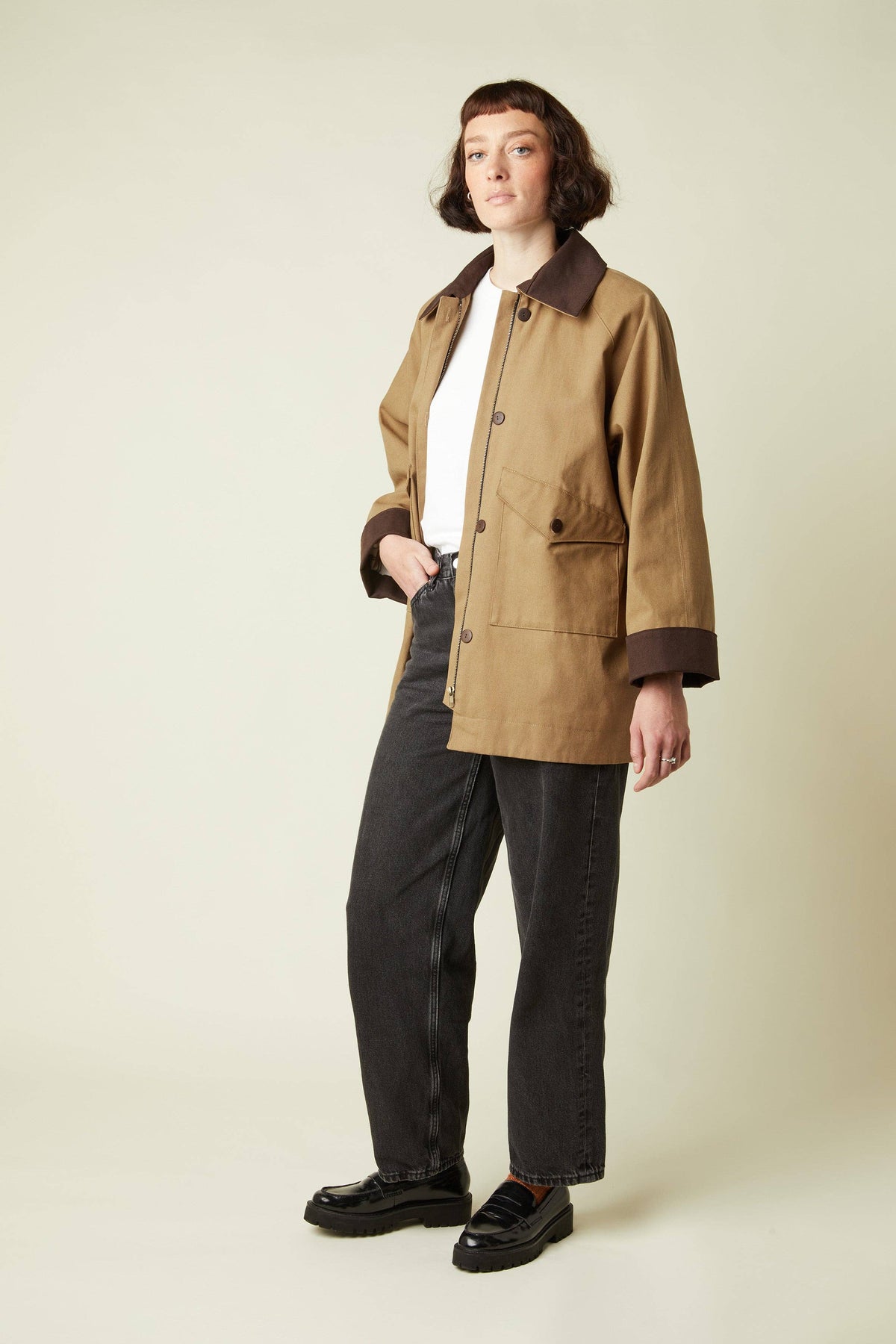 Model in a tan barn jacket made with the Atelier Brunette LA Barn Jacket printed sewing pattern, front view