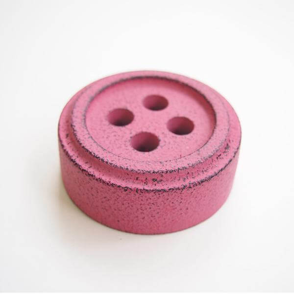Cohana Nambu iron paperweight and pattern weight, shaped like a pink button
