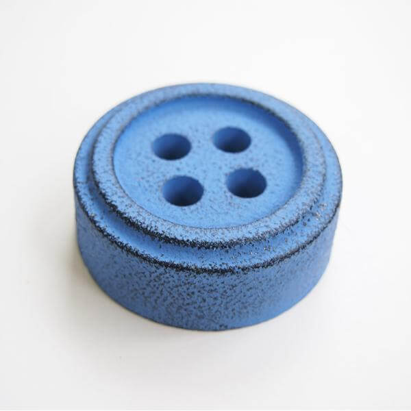 Cohana Nambu iron paperweight and pattern weight, shaped like a blue button