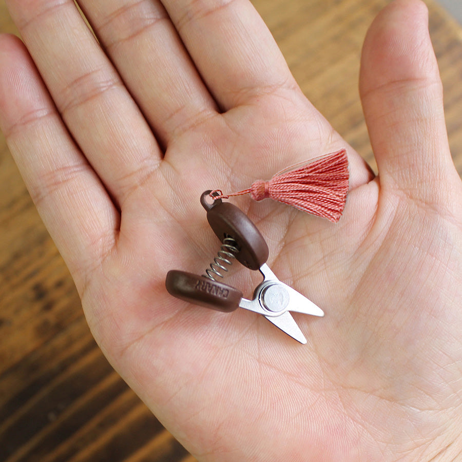 Cohana Seki mini scissors, held in palm to show the small size