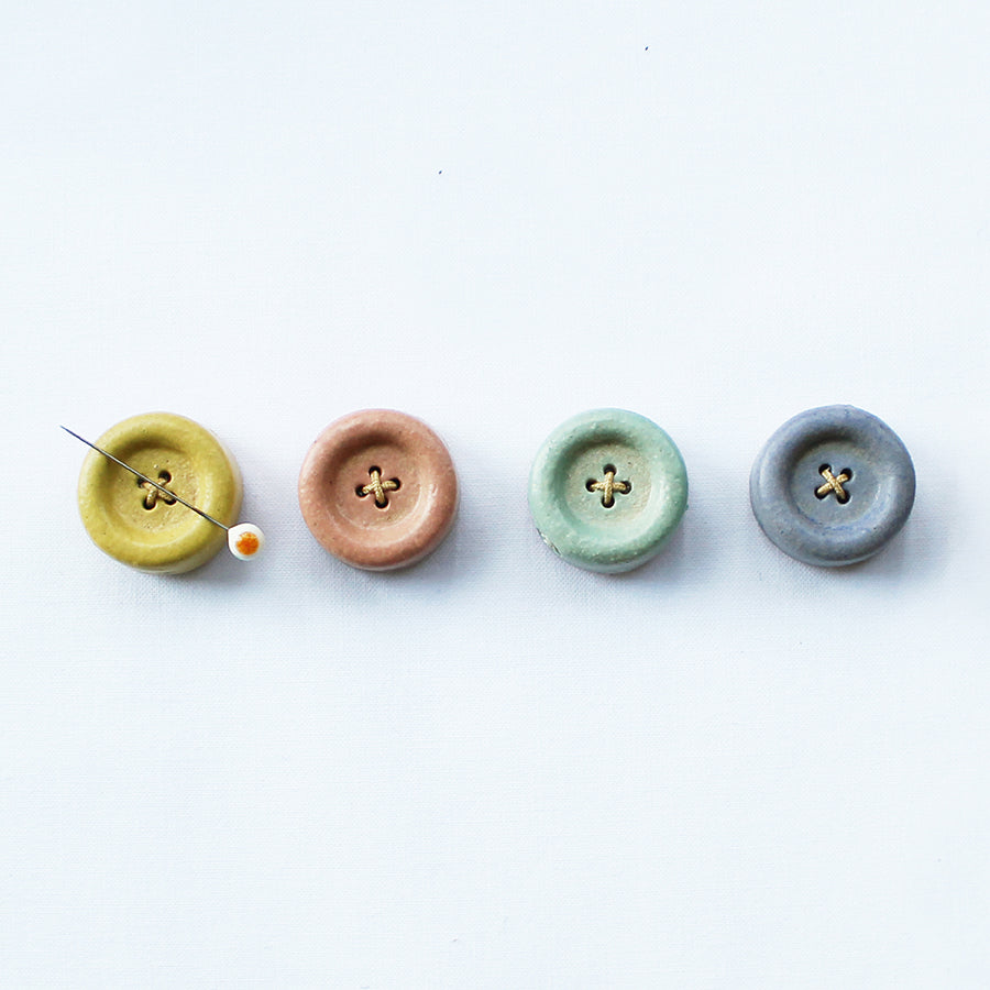 Cohana Shigaraki ware button magnet, in a row of five glaze colors
