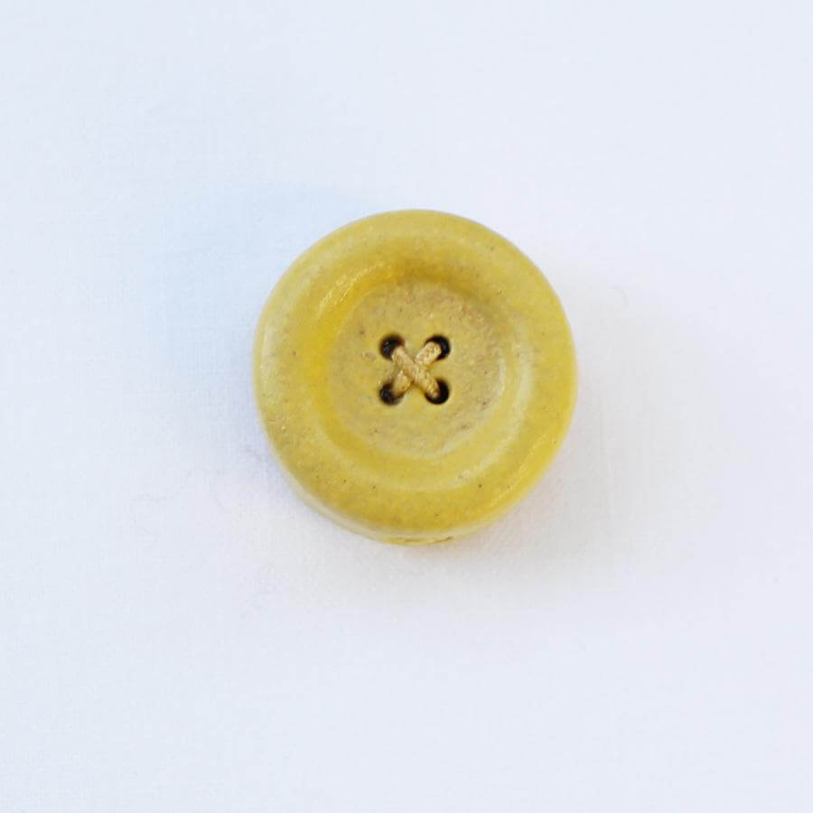Cohana Shigaraki ware button magnet, in yellow ceramic