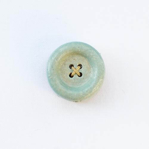 Cohana Shigaraki ware button magnet, in pale green ceramic