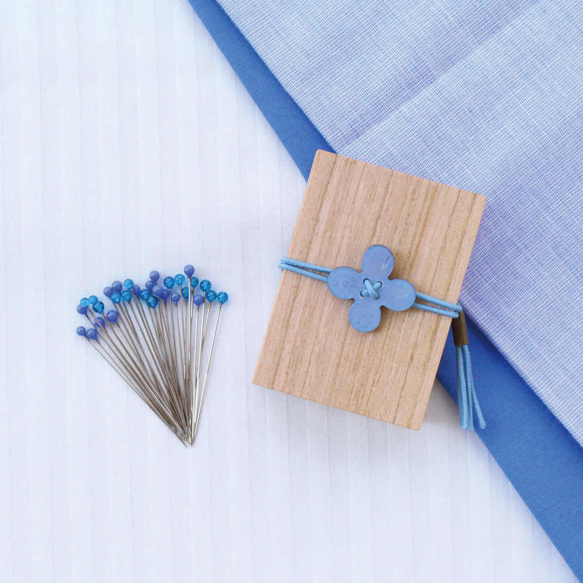 Cohana glass sewing pins in a cherry-wood box, with blue flower pins