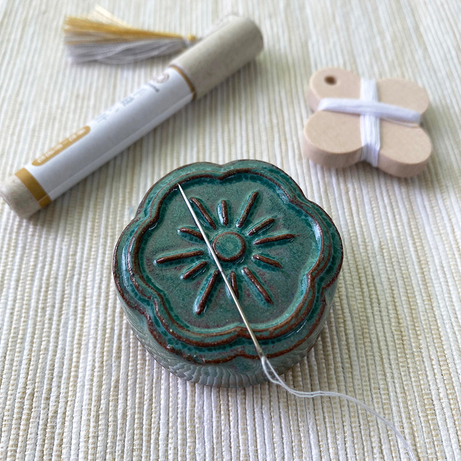 Cohana Awaji Kawara magnetic needle rest with needle polisher, in green with a needle