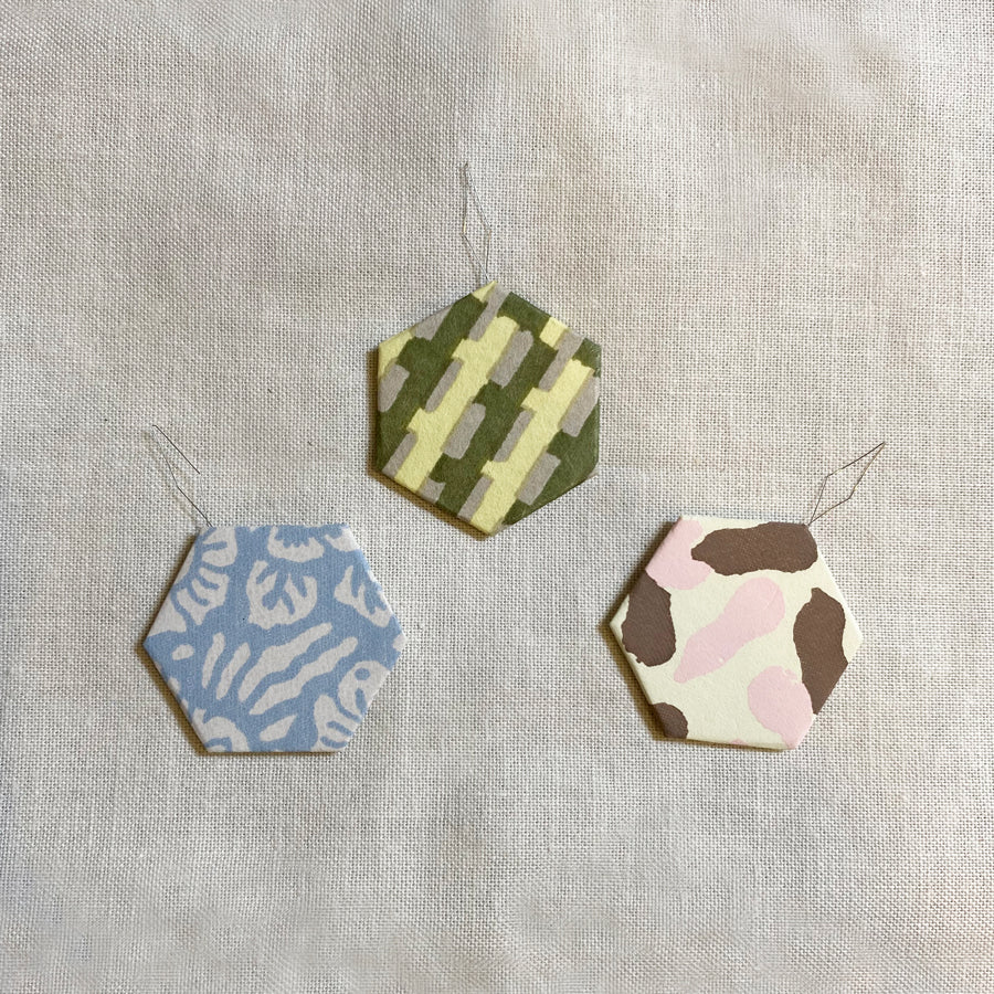 Cohana Haibara chiyogami needle threader, in green paper
