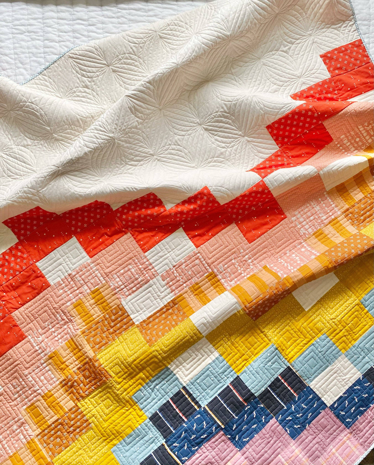 Penelope Handmade Ebb and Flow quilt pattern quilt folded to show the pieced chevrons in quilting cotton