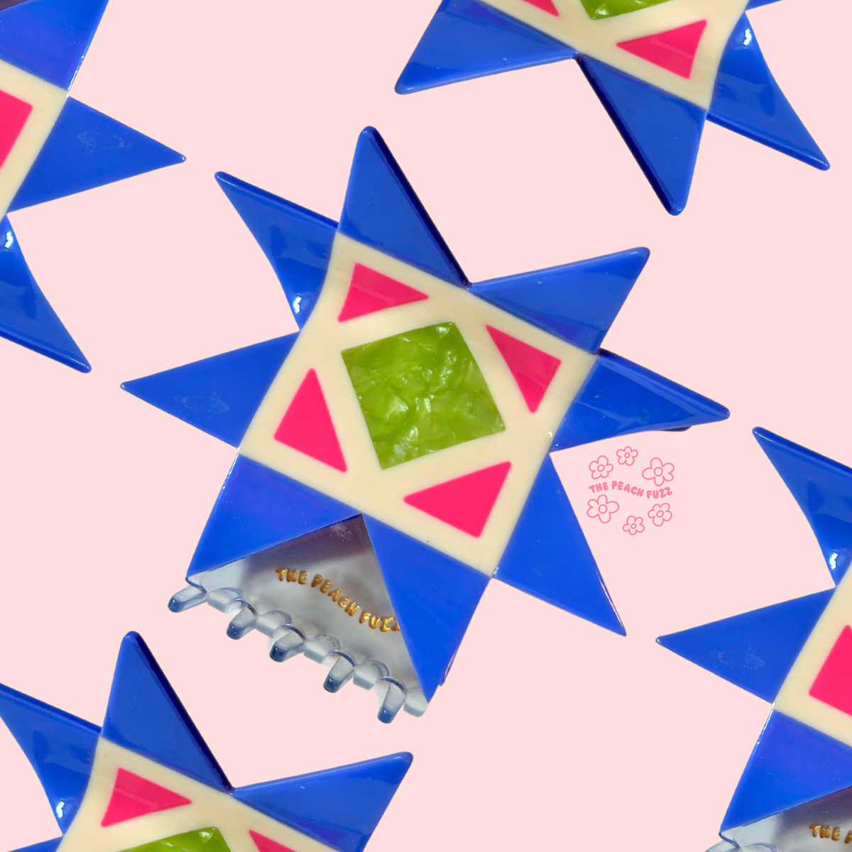 The Peach Fuzz quilt hair claw on a blue and yellow quilt block pattern