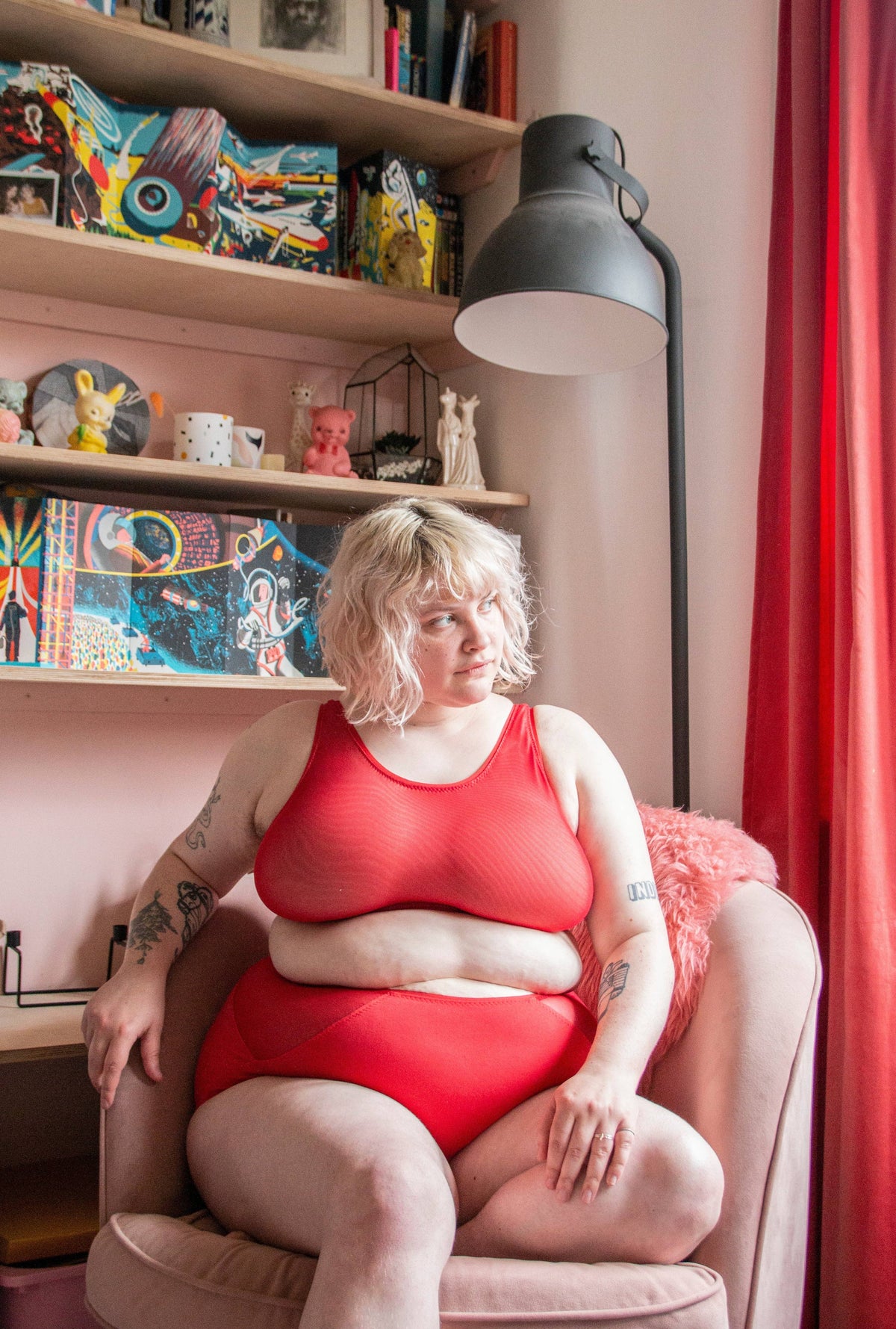 Sophie Hines Median Knickers sewing pattern, model seated in red high-waist knickers and bralette sewn from the pattern