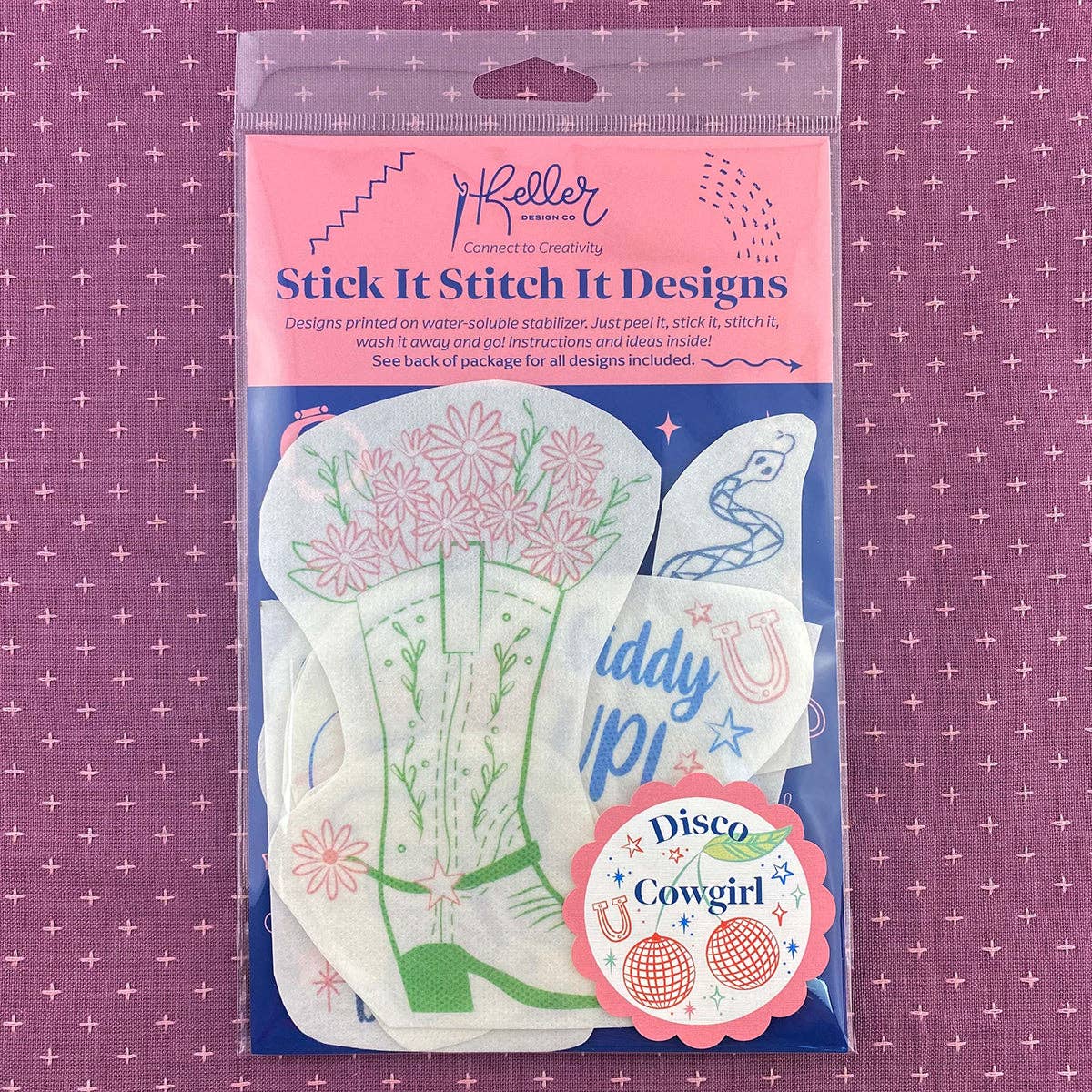 Keller Design Co. Disco Cowgirl stick and stitch embroidery patterns, package on purple fabric
