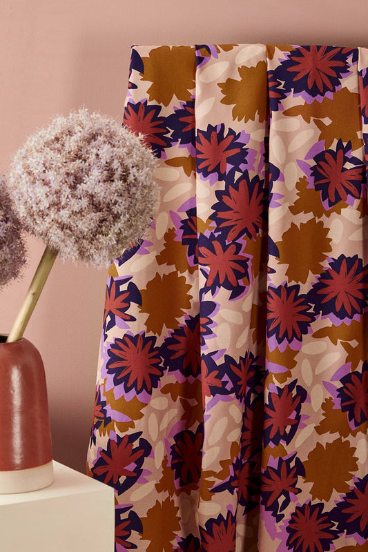 Atelier Brunette Waterlily Maple ECOVERO viscose in a brown and purple floral, styled with flowers