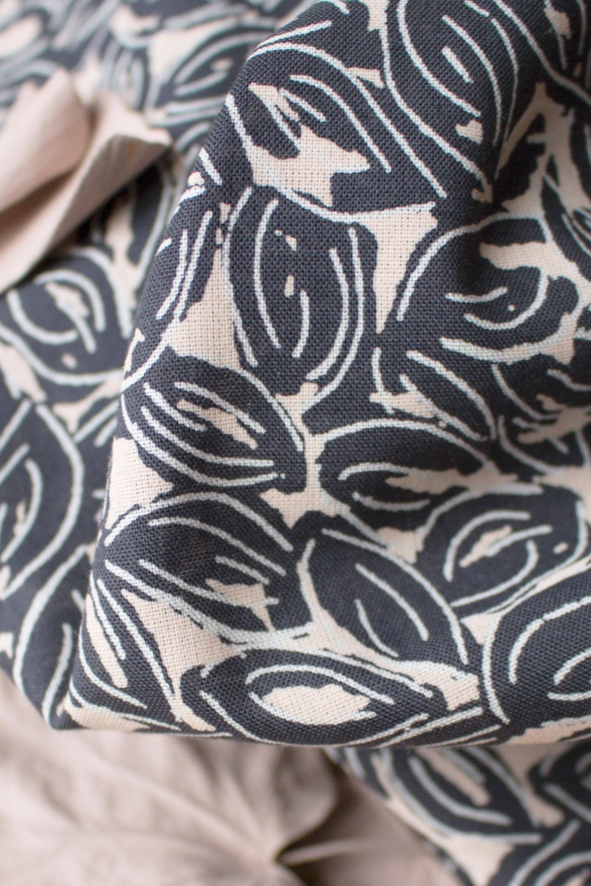 Atelier Brunette Petal Night cotton gauze in navy and cream leaf print, close-up