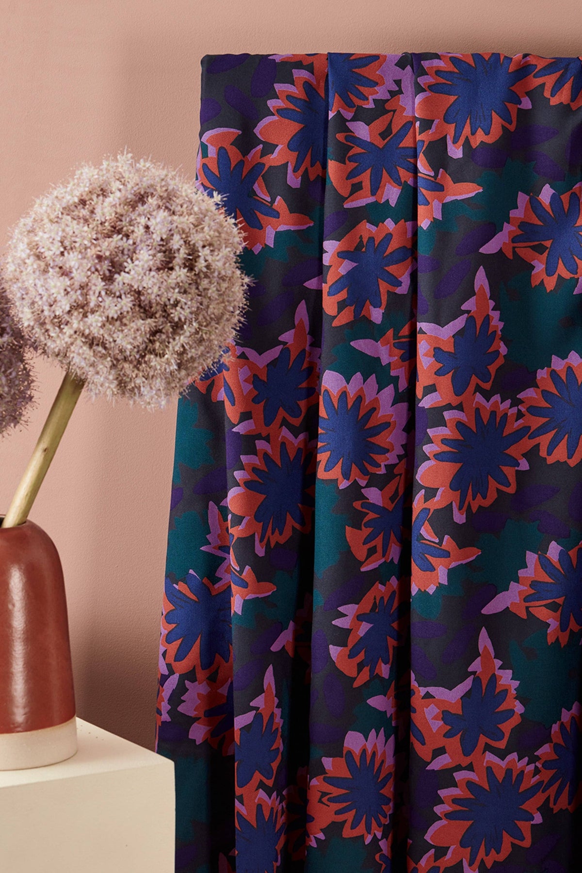 Atelier Brunette Waterlily Night fabric, navy floral apparel fabric styled with flowers