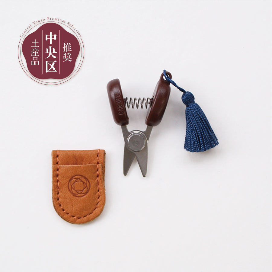 Cohana Seki mini scissors, with a red tassel and leather sheath
