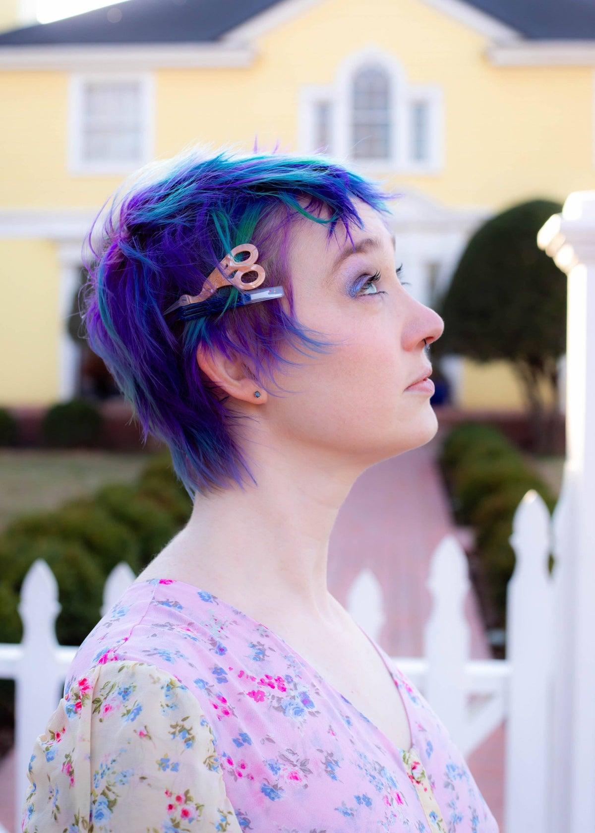 The Peach Fuzz sewing kit hair clips in blue and purple hair, side view
