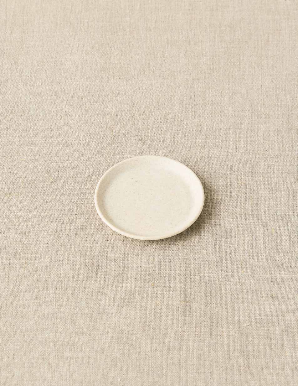 CocoKnits notions dish in cream, a small ceramic tray for stitch markers
