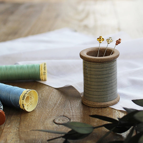 Cohana Hasami magnetic pin holder, on a desk with pins
