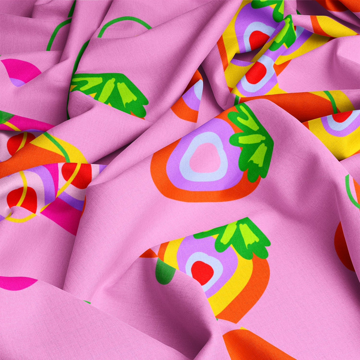 Jam Session fabric draped to show the strawberry print on a pink background