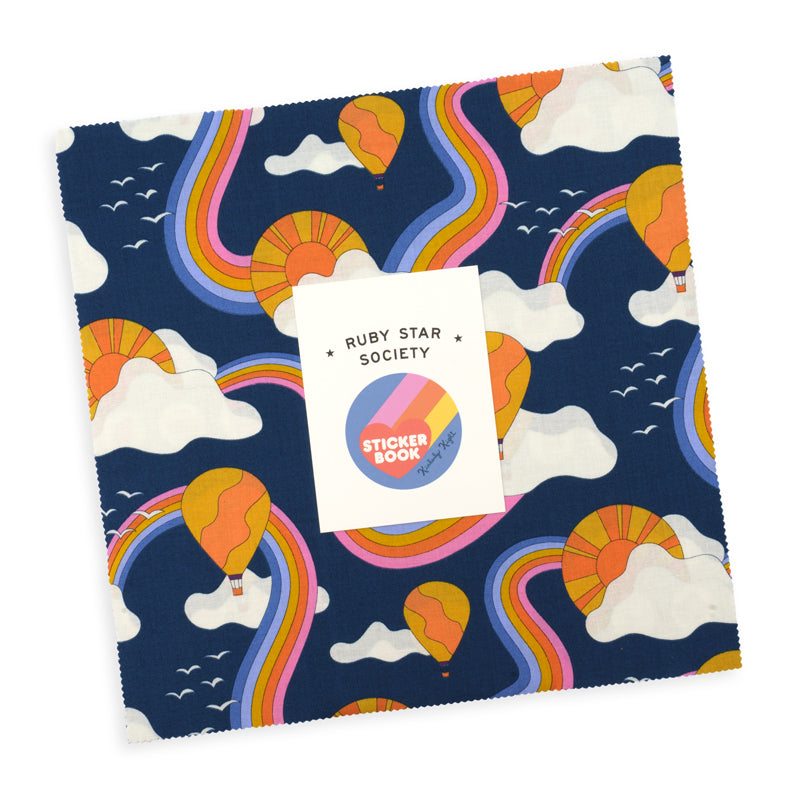 Ruby Star Society Sticker Book layer cake, 10 inch quilting cotton squares with a navy unicorn and rainbow print on top