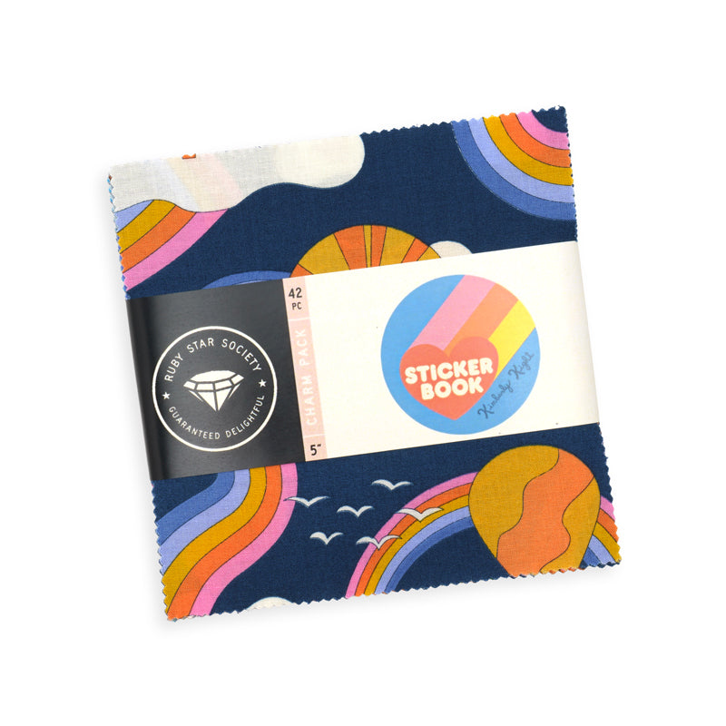 Ruby Star Society Sticker Book charm pack, 5 inch quilting cotton squares wrapped in a rainbow and navy label