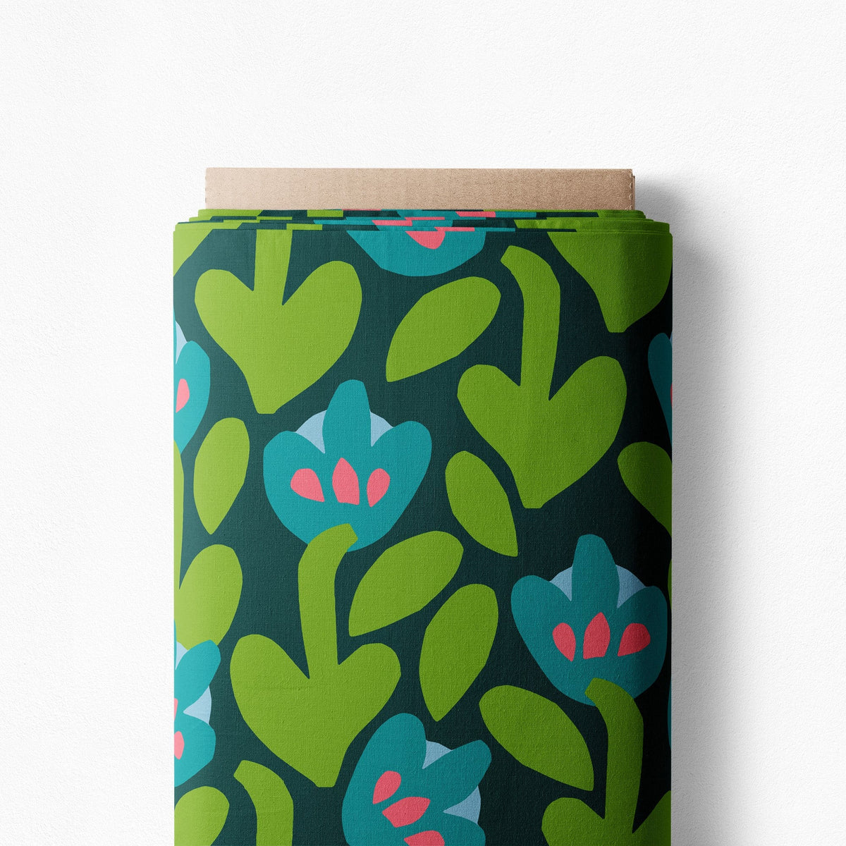 Sea Meadow cotton poplin on a bolt, lime leaves and teal flowers on a deep green background