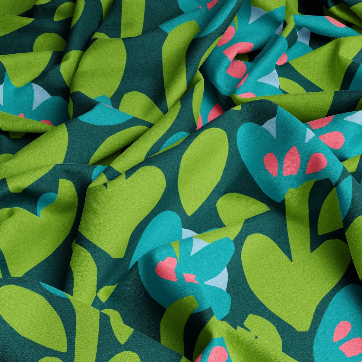 Sea Meadow fabric draped to show the green collage floral print