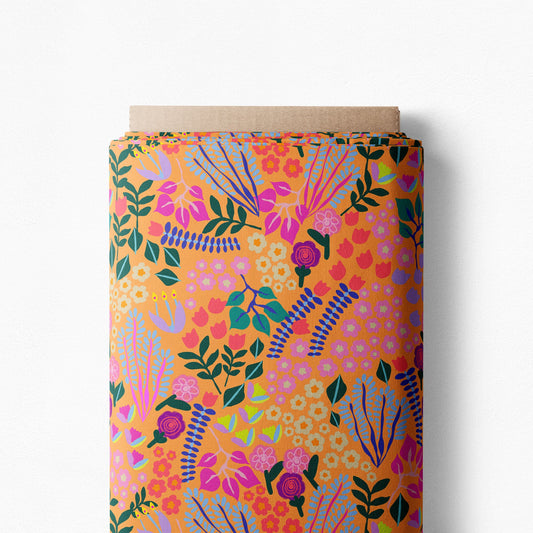 Velvet Garden in Ochre mini-scale print on a bolt, small pink and purple flowers with turquoise leaves on ochre