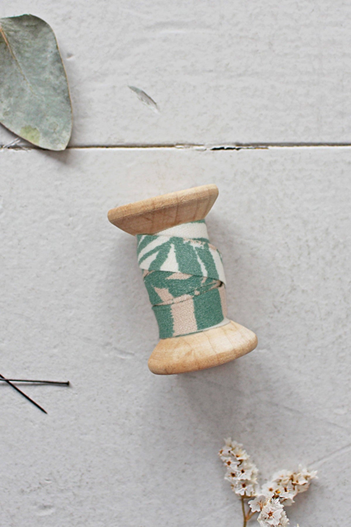 Atelier Brunette Canopy Cactus bias tape spool with eucalyptus leaves