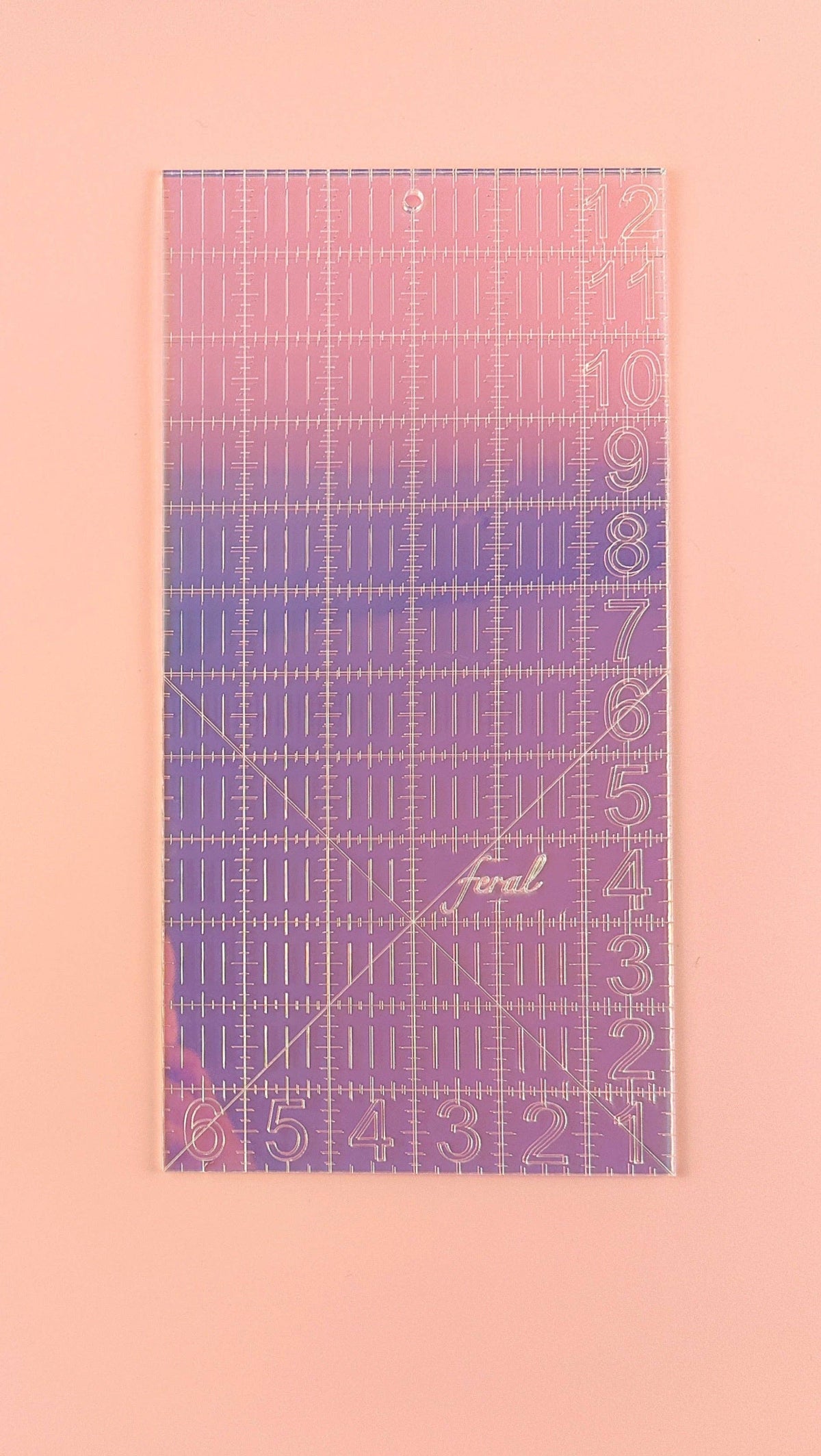 Feral Notions 6 x 12 inch quilting ruler in iridescent purple acrylic, straight-on view of the grid