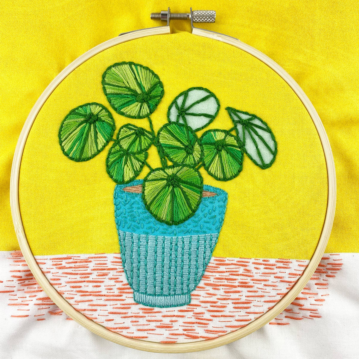 Keller Design Co. Pilea plant embroidery kit, finished hoop with a pilea in a blue pot