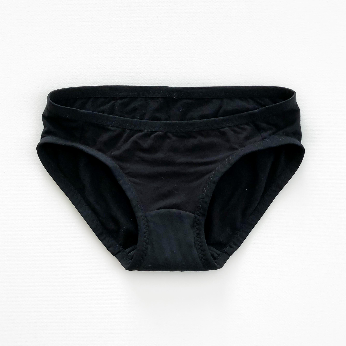 Sophie Hines Period Panty Sewing Kit in black, finished black period underwear laid flat