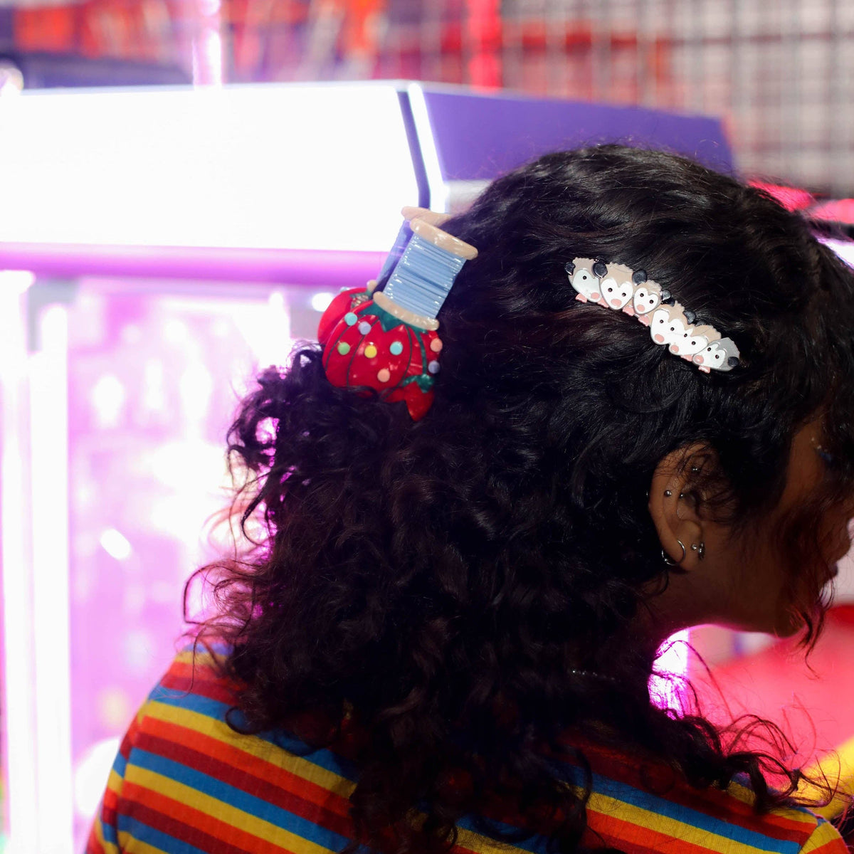 The Peach Fuzz pin cushion hair claw in curly hair