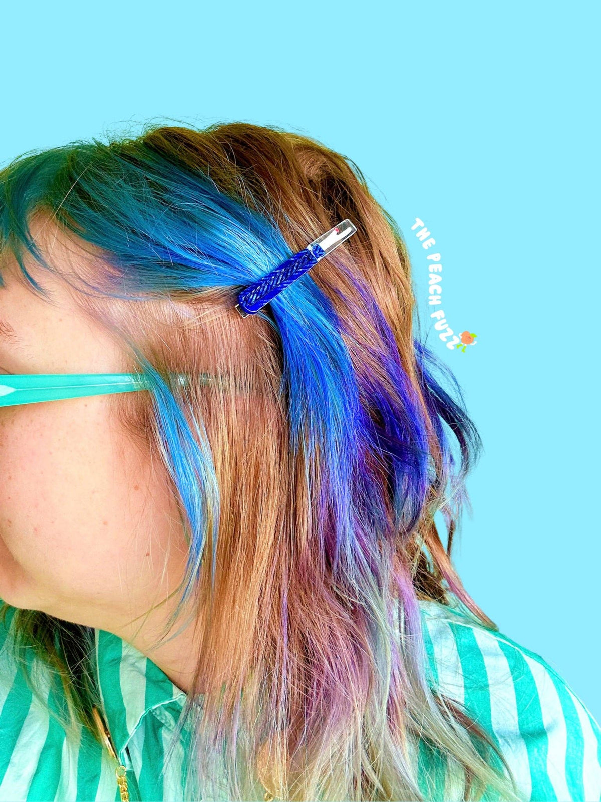 The Peach Fuzz sewing kit hair clips worn in rainbow hair