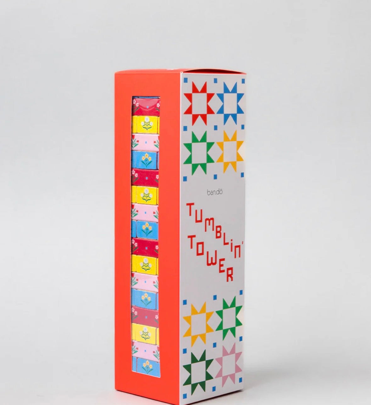 Ban.do Tumblin' Tower quilted blocks game in its tall box, a gift for quilters