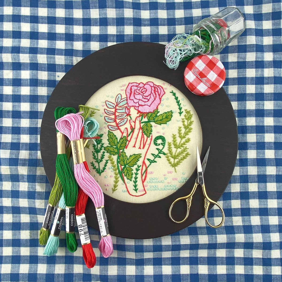 Keller Design Co. Hello From Rose City embroidery kit, hoop on a blue gingham cloth