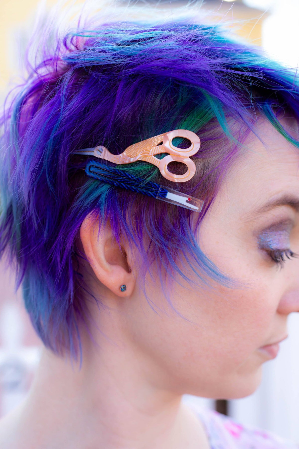 The Peach Fuzz sewing kit hair clips worn in purple hair
