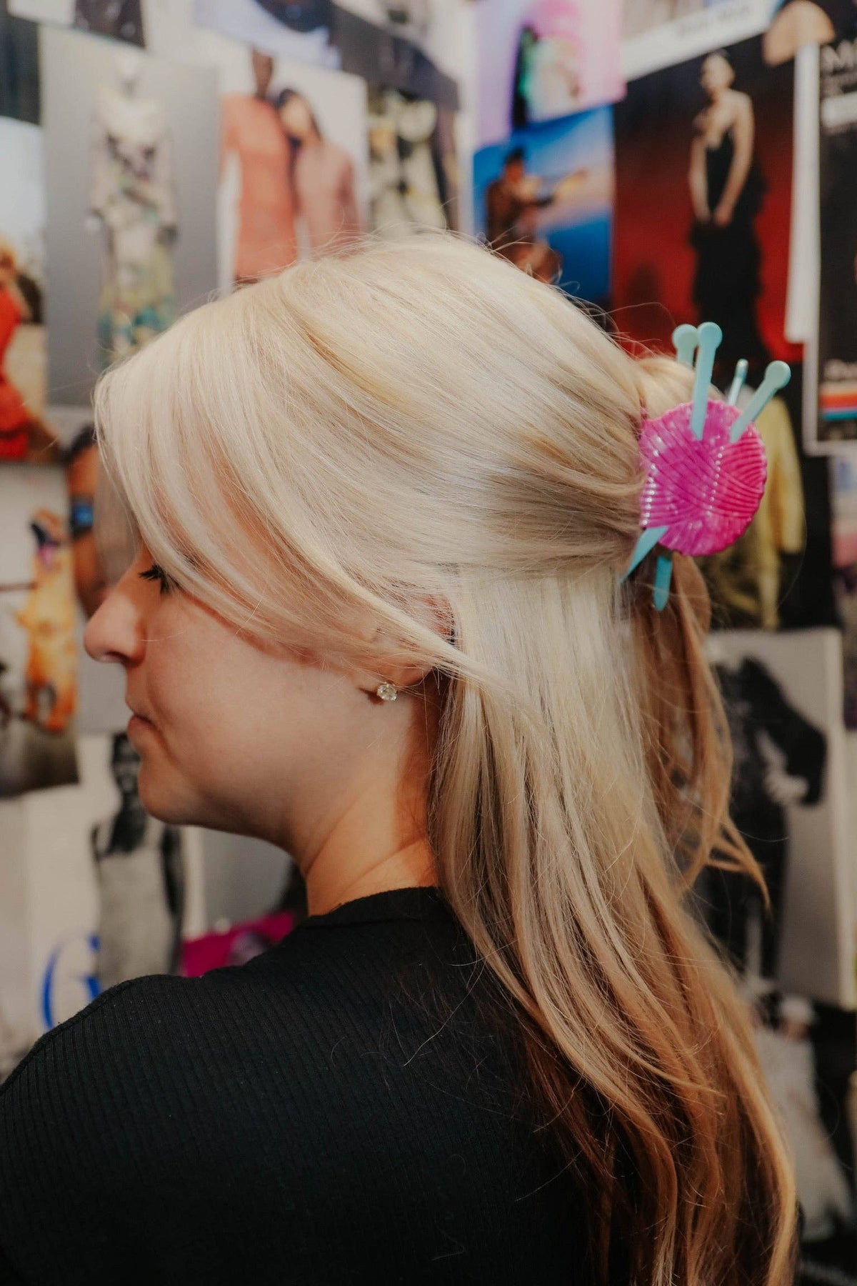 The Peach Fuzz knitting needle hair claw worn in blonde hair, side view