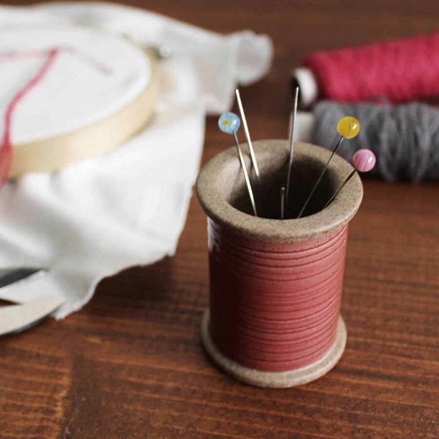 Cohana Hasami magnetic pin holder, with pins on a white cloth