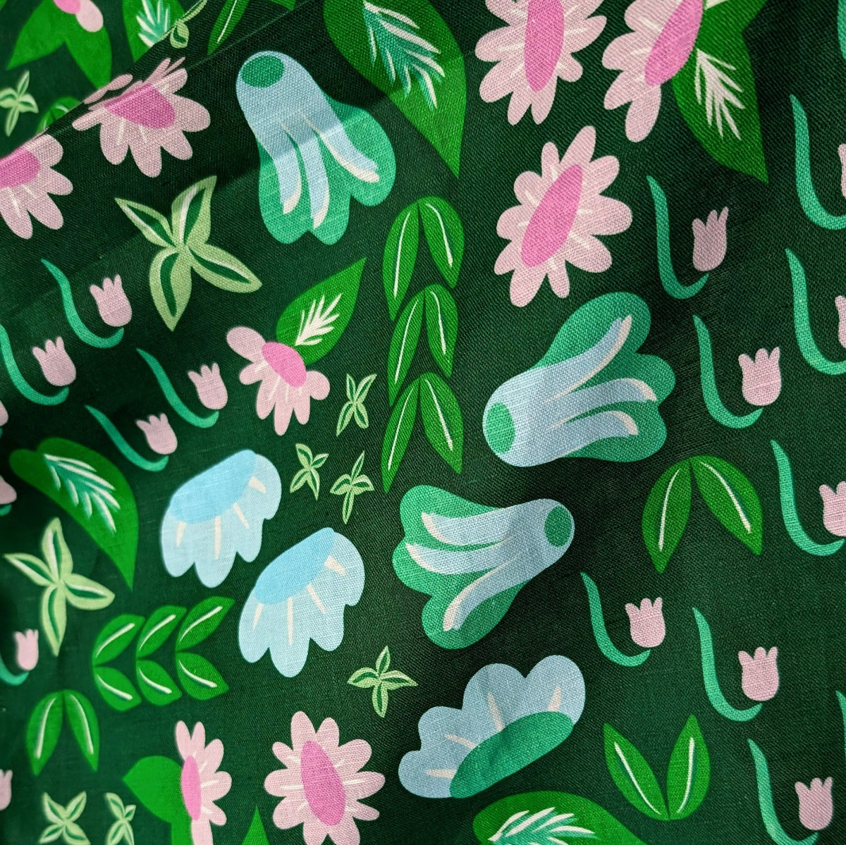 Flat view of the Lakewood floral print in green, light blue, and pink